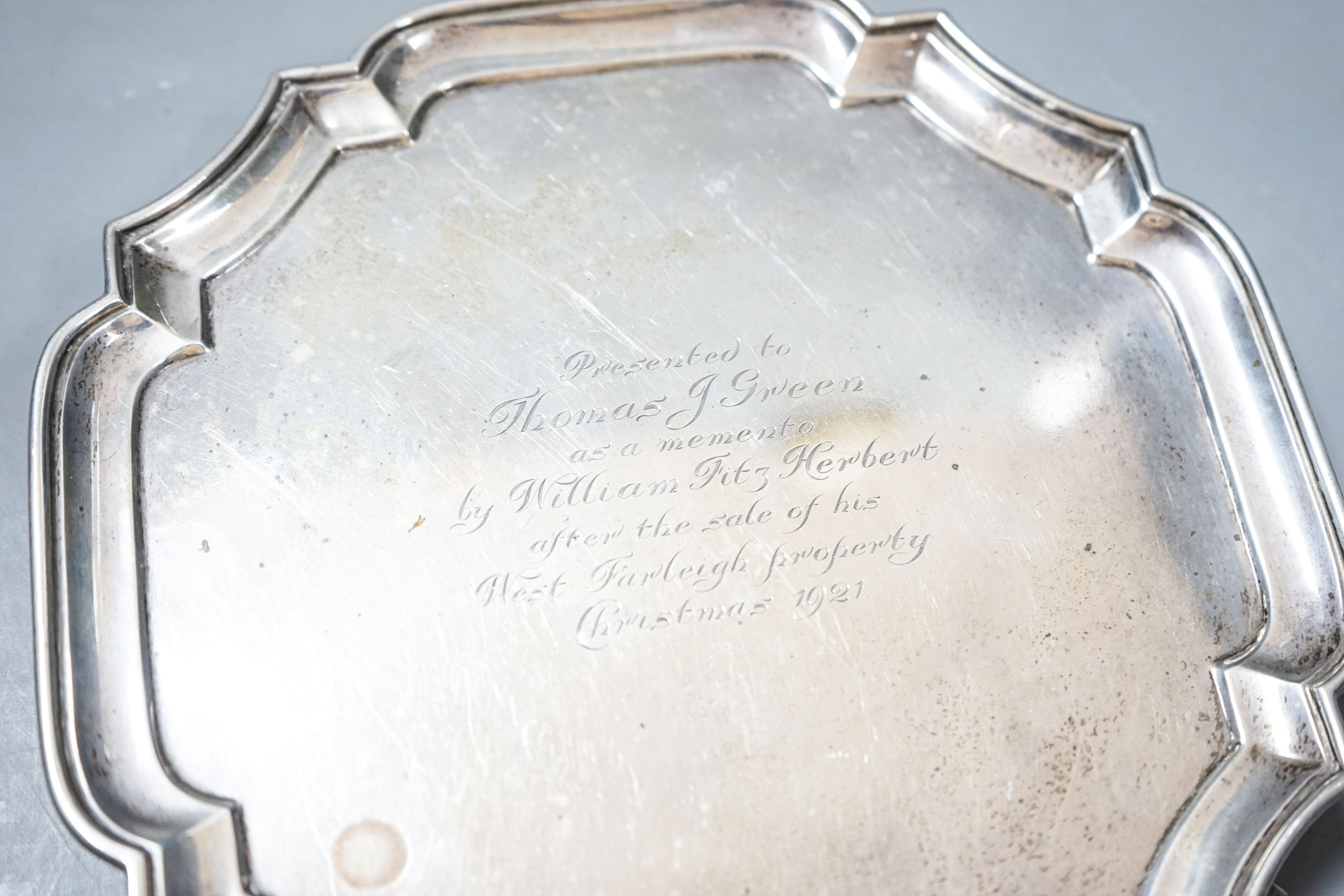 A George V silver shaped square waiter, with engraved inscription, Goldsmiths & Silversmiths Co Ltd, London, 1921, 25cm, 11.5oz.